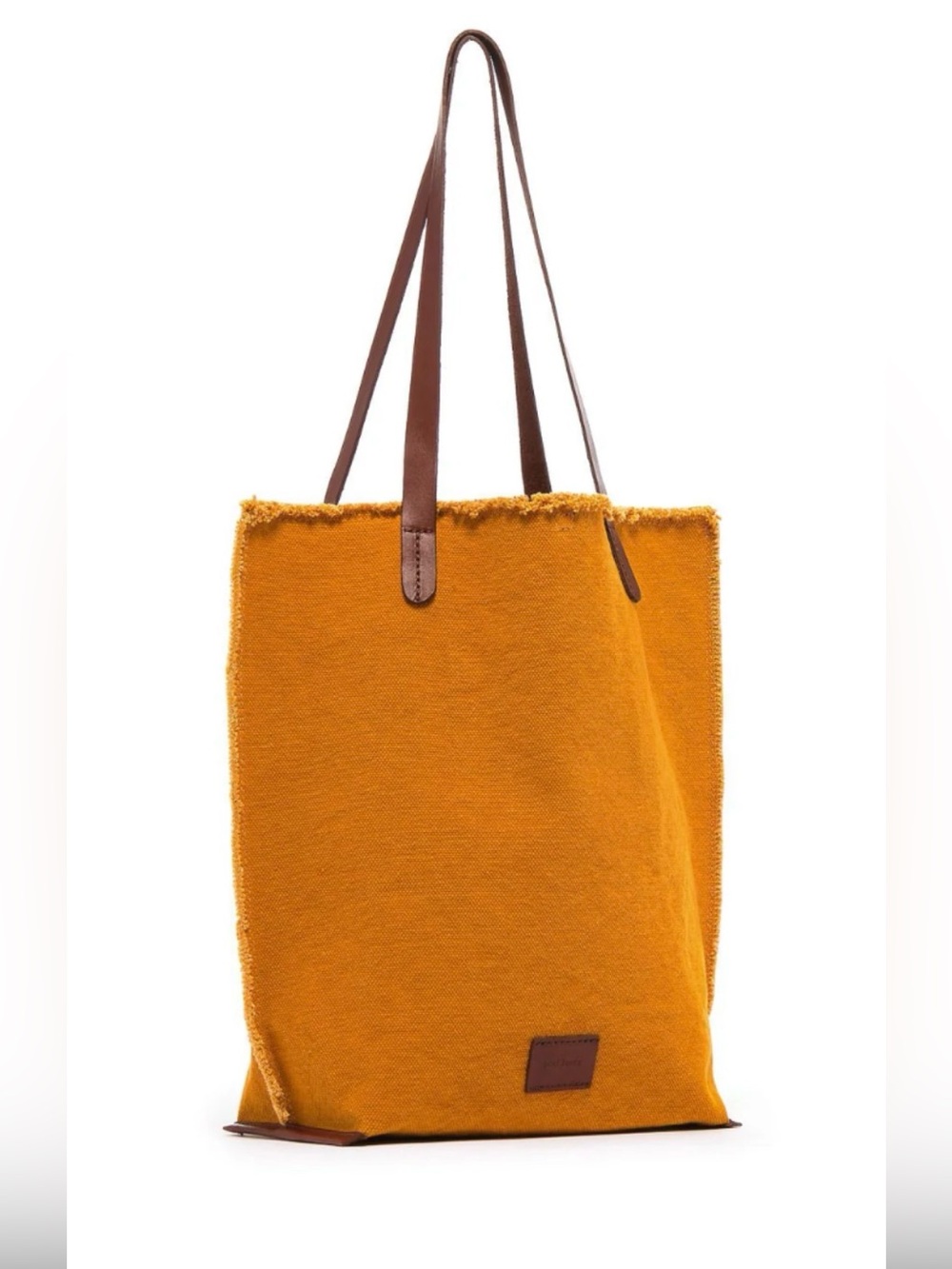Graf Lantz Canvas Boat Bag features a turmeric cotton canvas dark leather strap